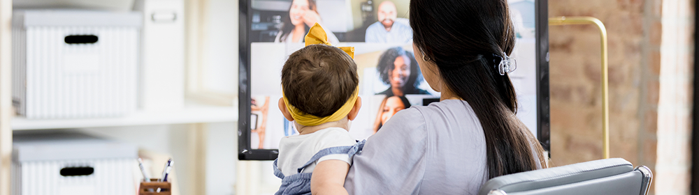 Mother watching a virtual meeting